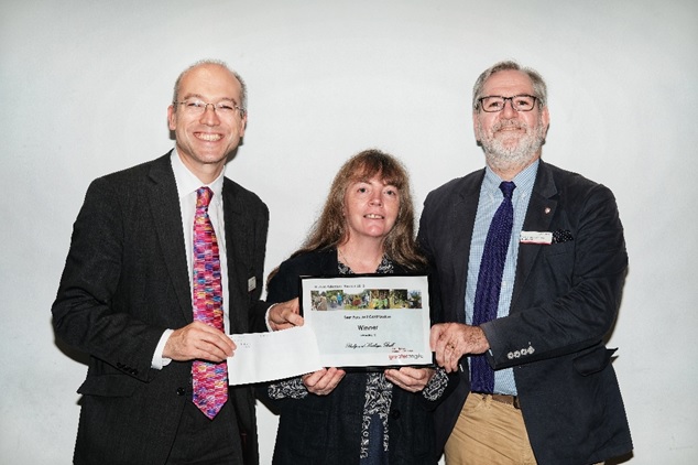 Philip (right) and Kathryn (centre) receive an award for their work at Shelford station.