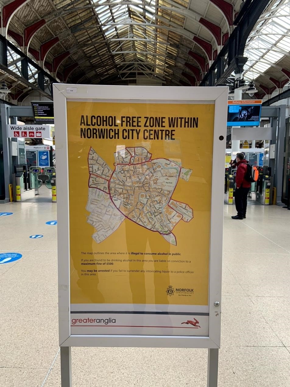 'Alcohol free zone within norwhich city centre' written on a yellow poster 