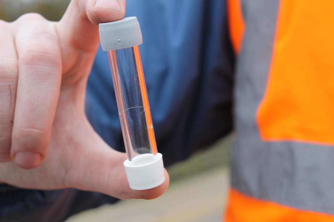 A diffusion tube(a small glass cylinder with plastic caps) used to measure air quality 