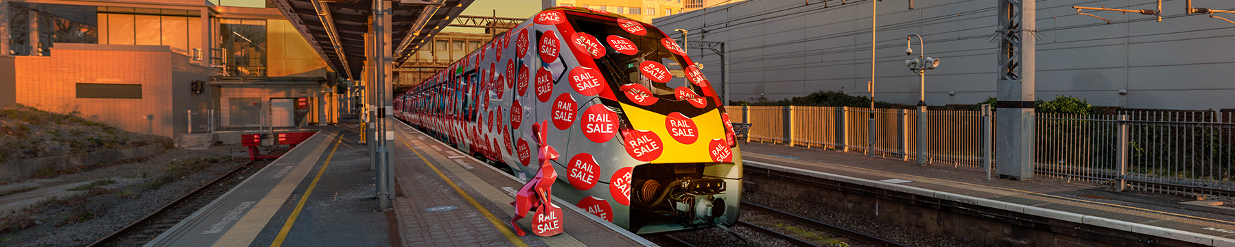 hare covering Greater Anglia train in lots of rail sale stickers