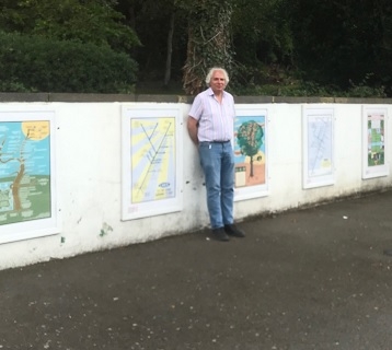 The artist, Maxwell Roberts next to the “Four Seasons on the Essex Sunshine Coast” art display.