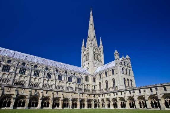 Norwich cathedral under a clear blue sky