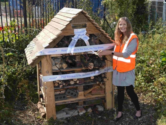 Greater Anglia’s Environment and Energy Manager, Stephanie Evans, cuts the ribbon on the insect hotel