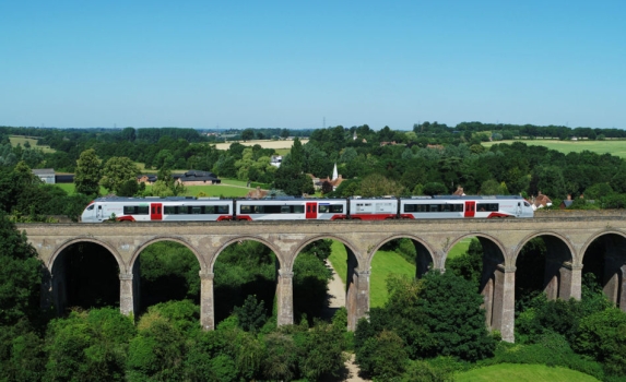 A new Greater Anglia train crosses the Chappel Viaduct at Chappel &amp; Wakes Colne 