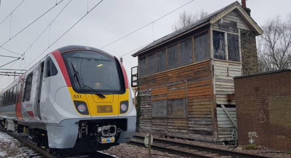 One of Greater Anglia's new trains next to the signalbox