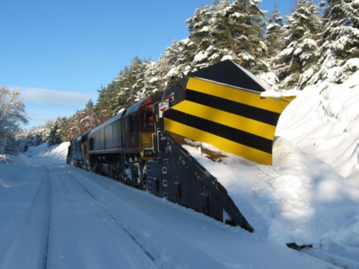 Train ploughing through thick snow