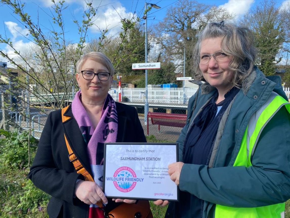 Sally-Ann Ford and Amy Rayner, Saxmundham station adopters, receive their accreditation. 