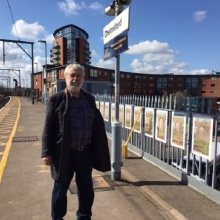 : Artist, Wladyslaw Mirecki, with the paintings at Chelmsford station