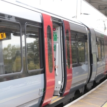 Greater Anglia train at a platform with one of the doors open