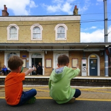 Two kids at the train station