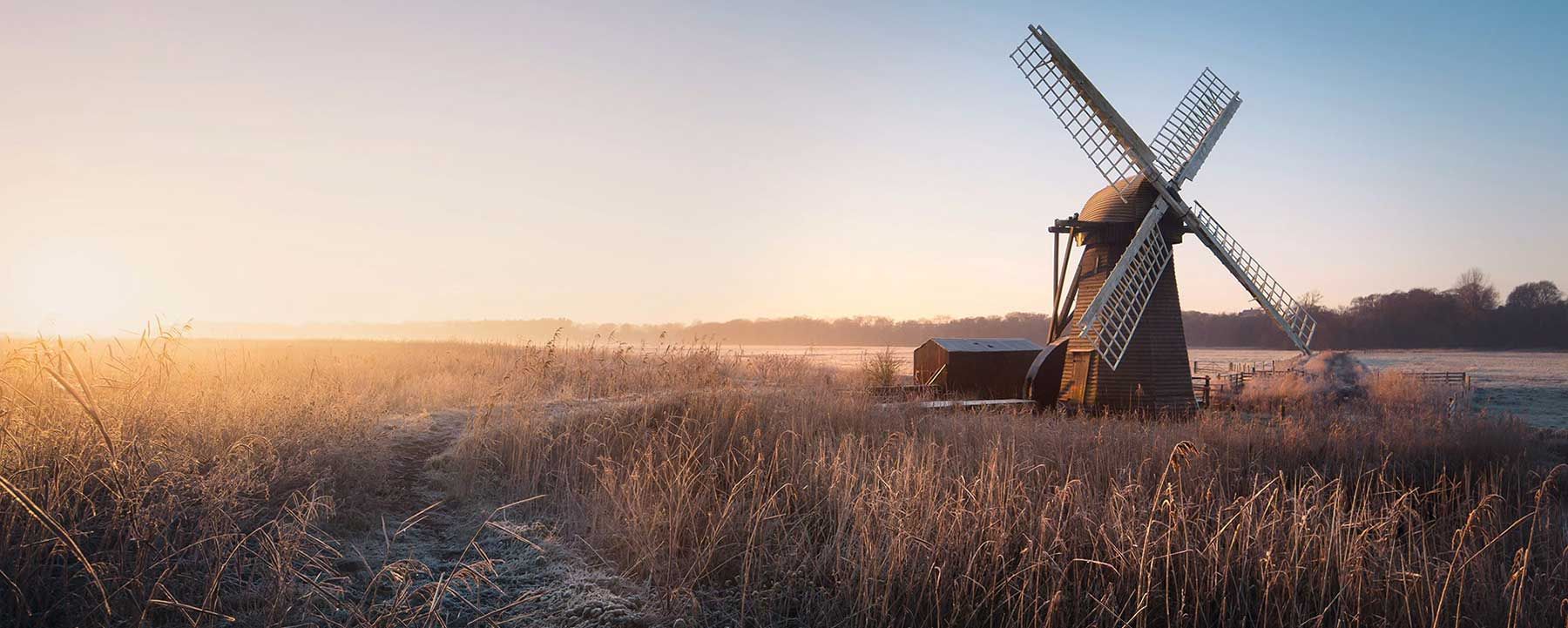 Windmill in winter landscape